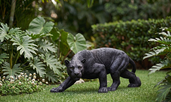 Big cat statue - black panther jaguar sculpture in a prowling pose for garden display